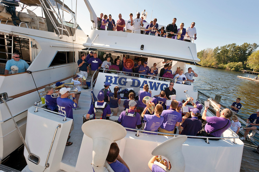 Members of the UW marching band perform on Big Dawg, parked at docks next to Husky Stadium. ©2011 Stuart Isett. All rights reserved.